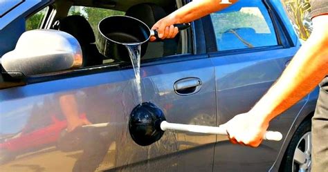 pulling out dents in cars.